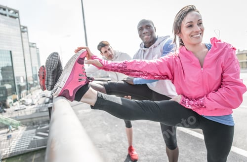 Preview: Group of urban runners making sport in an urban area