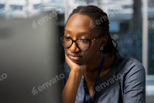 Preview: Bored data center technician at work inspecting gear, doing monotonous tasks