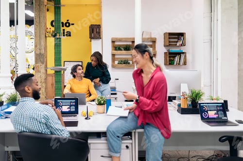 Preview: Happy Coworkers Talking in the Office