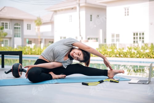 Preview: Happy asian woman stretching exercise at home