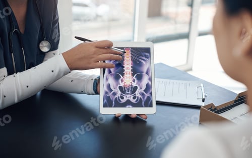 Preview: Shot of a young female doctor showing a patient a digital x-ray in an office