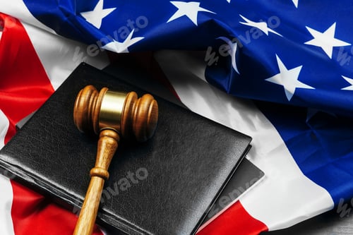 Preview: Gavel on wooden table with USA flag