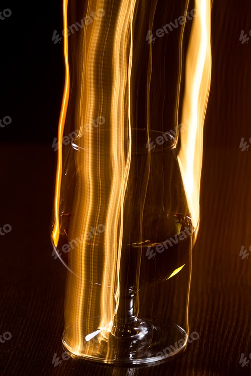 Preview: Golden glass of whiskey and yellow lines