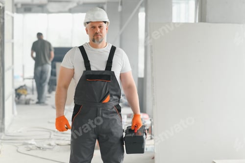 Preview: Man Builder. Architect is standing in building. Portrait of thinking builder.