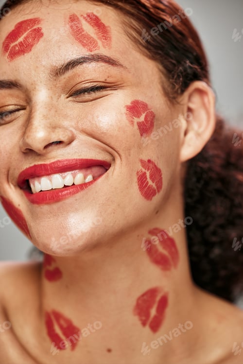 Preview: Face, red lipstick kiss and makeup on face model woman in studio for cosmetics and happiness. Heads