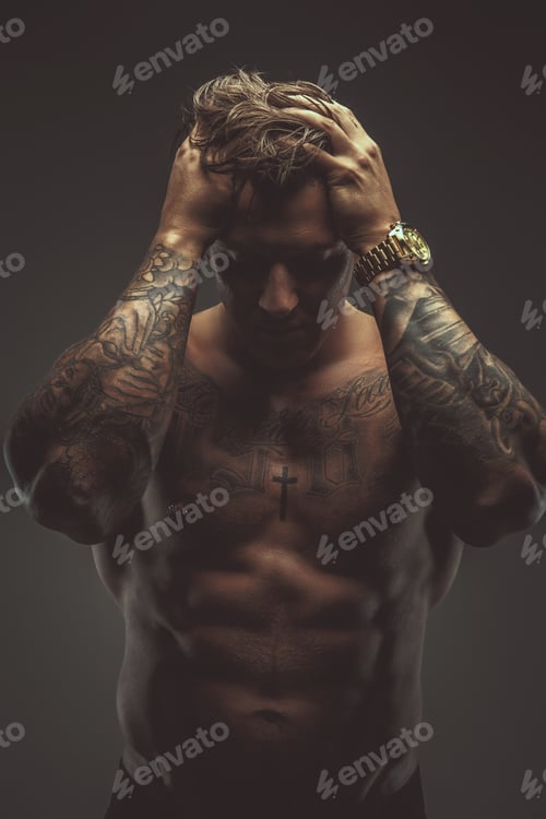 Preview: Strong shirtless tattooed man.