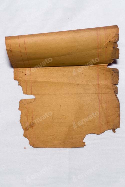 Preview: An old sheet of paper rolled up and partially torn with red lines