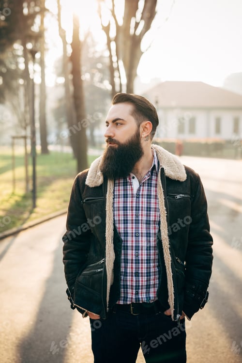 Preview: Young bearded man in park