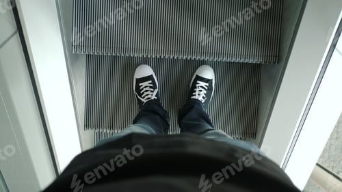 Preview: Male legs on escalator
