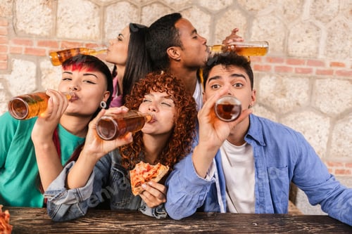 Preview: Friends enjoying drinks and pizza at a casual gathering