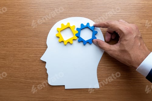 Preview: Human head cutout with gears being adjusted by a hand.