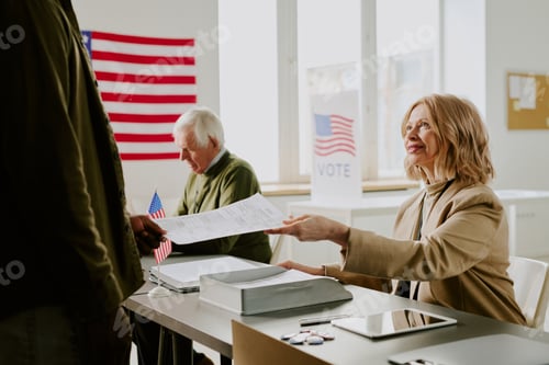 Preview: Cheerful Mature Woman Working At Voting Station
