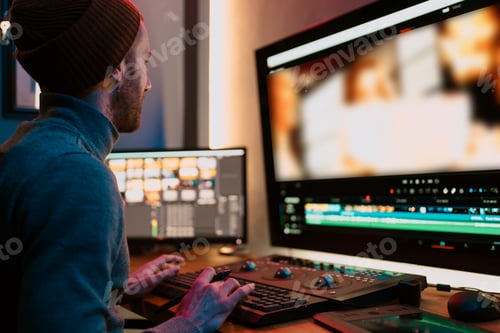 Preview: Male Video Editor Working on His Personal Computer with Big Display