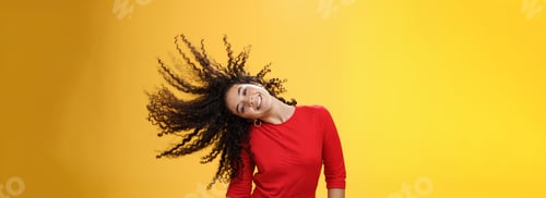 Preview: Girl getting carefree and wild waving hair and making sun with curls flying in air smiling broadly