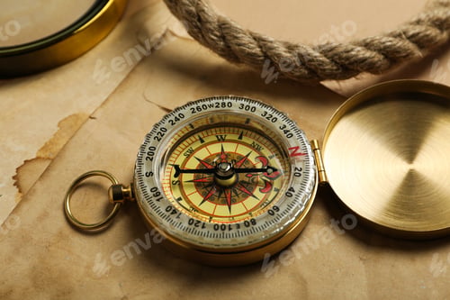 Preview: Sea travel concept. Vintage compass on the table