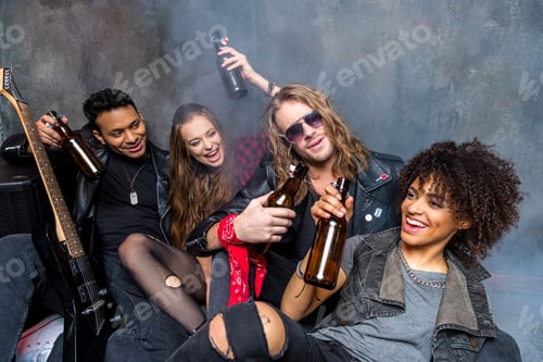 Preview: friends drinking beer after rehearse in studio, rock and roll band concept