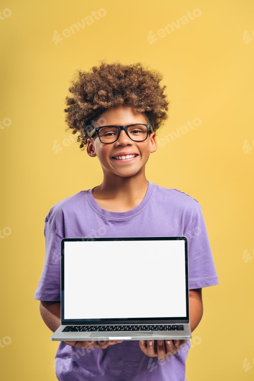 Preview: Happy, smart African American boy wearing eyeglasses, holding laptop with empty screen white display