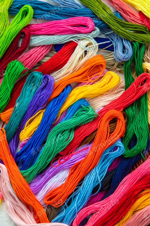 Preview: Threads for embroidery are multi-colored. Selective focus.