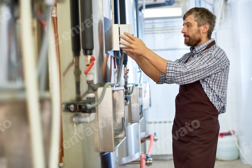 Preview: Bearded Engineer Working at Brewery
