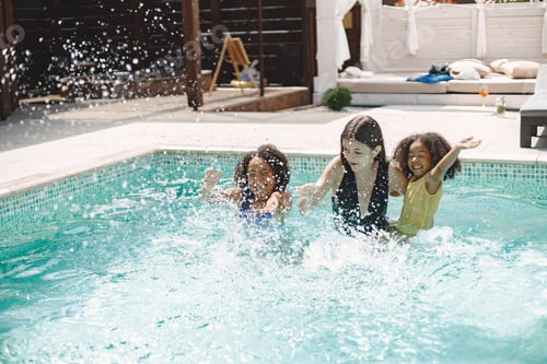 Preview: Two african american daughters and their caucasian mother swimming in the pool
