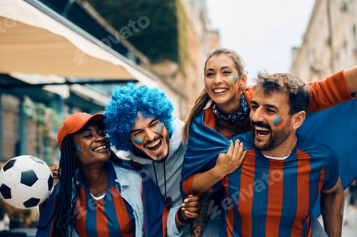 Preview: Group of young soccer fans having fun while going on a match during the world cup.
