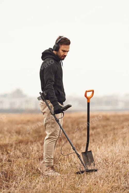 Preview: In the field. Man is with metal detector