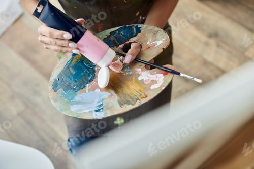 Preview: A young woman with short hair explores her creativity through cozy home painting