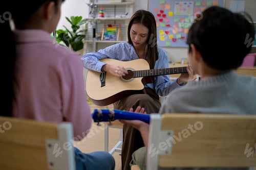 Preview: Guitar Class, Teacher and students in music classroom