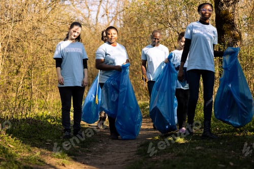 Preview: Group of environmentalists gathering to clean the forest area from junk