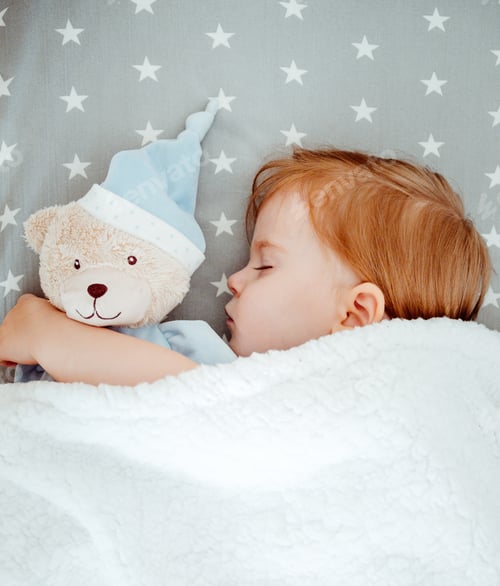 Preview: Little baby girl sleeping with her bear toy.