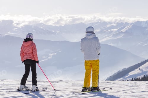 Preview: man and woman skiing and snowboarding in the mountains, ski reso