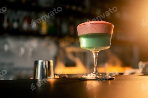 Preview: Cocktail with rose on bar counter in restaurant pub Orange drink with juice Fresh prepared alcoholic