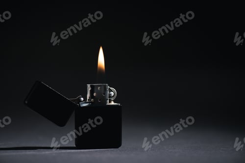 Preview: lighter with burning fire on black with copy space