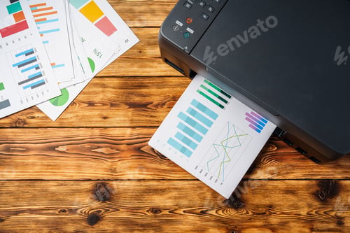 Preview: Modern laser printer with paper on wooden background