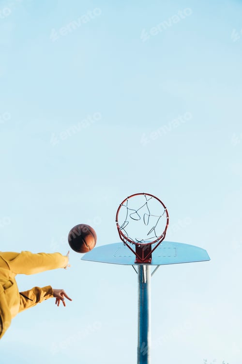 Preview: Young girl playing at the street basketball court