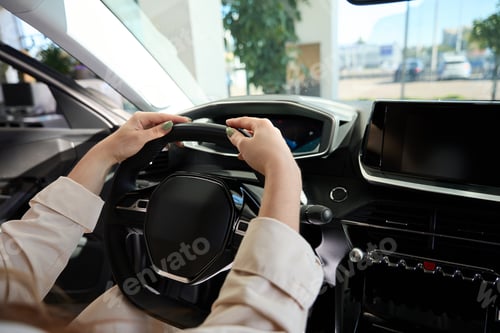 Preview: Woman choosing new vehicle at auto dealership