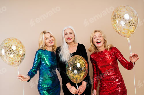 Preview: Happy senior women having party