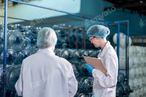 Preview: Caucasian female scientist working in laboratory at factory warehouse.