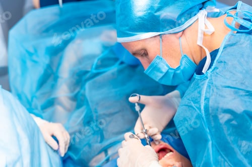 Preview: Dental clinic, dentist doctor applying an injection to the patient before the operation