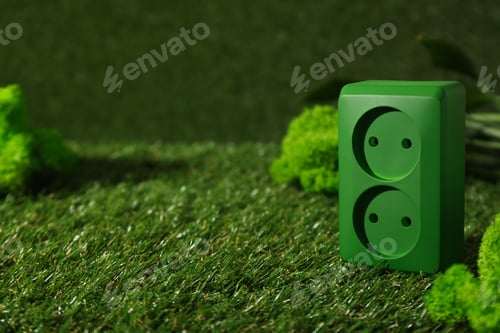 Preview: Green electrical socket on the grass, eco house concept