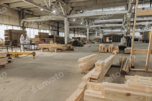 Preview: Wooden planks lying on floor in large manufacturing workshop