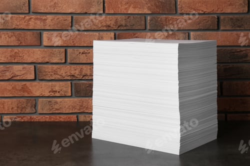 Preview: Stack of paper sheets on black table