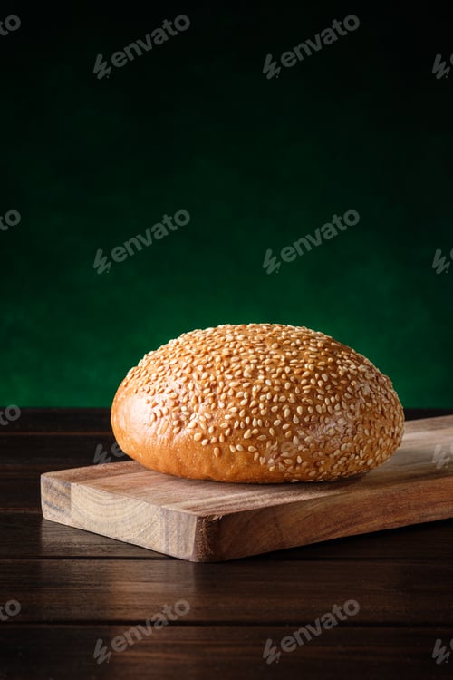 Preview: Burger bun on a wooden cutting board
