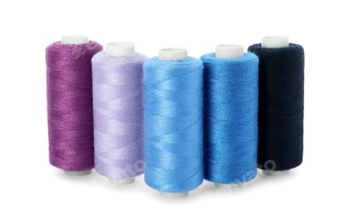 Preview: Set of different colorful sewing threads on white background