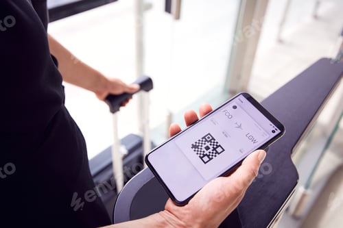 Preview: Close Up Of Male Passenger In Airport Looking At Digital Boarding Pass On Smart Phone