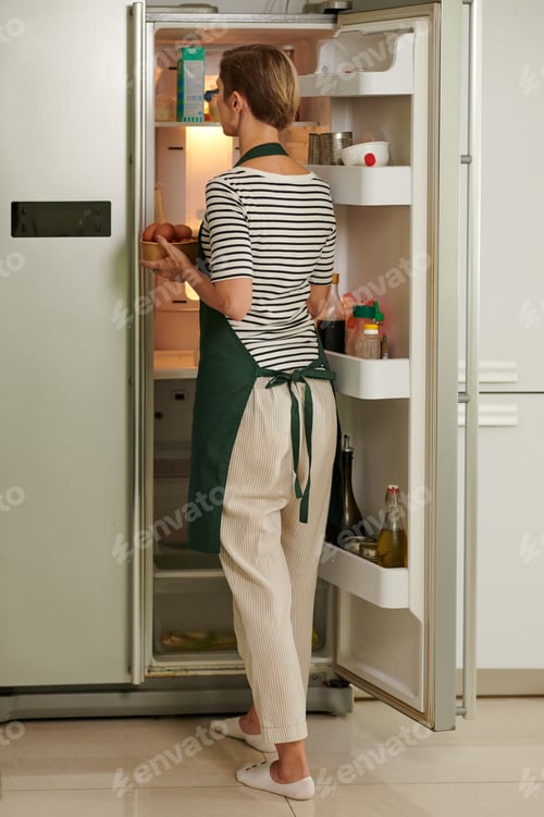 Preview: Woman Taking Taking out Ingredients