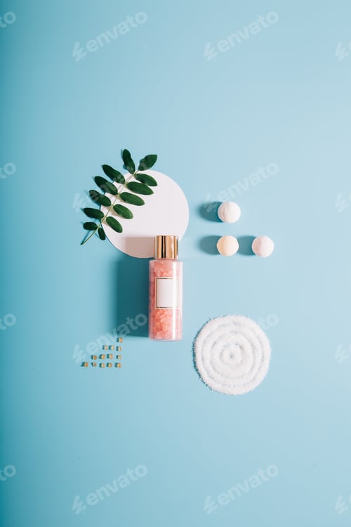 Preview: Mockup Spa bottle with pink bath salt on blue background.