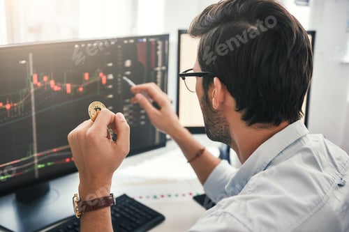 Preview: Back view of young professional trader in eyeglasses pointing on the data