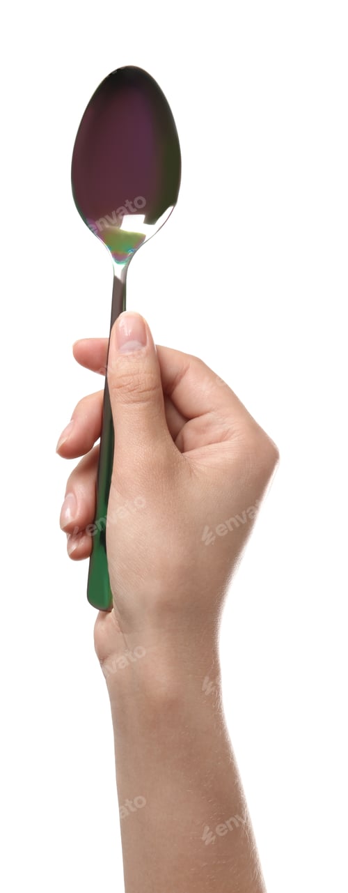 Preview: Woman holding clean tablespoon on white background, closeup