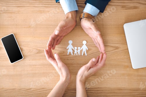Preview: partial view of insurance agents and female hands with family paper model on wooden tabletop, family